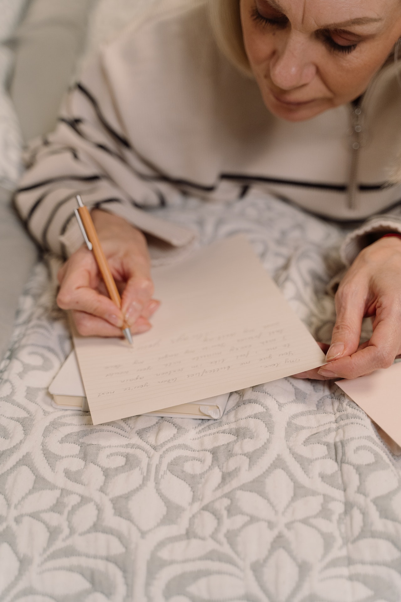 A lady writing a perfect obituary